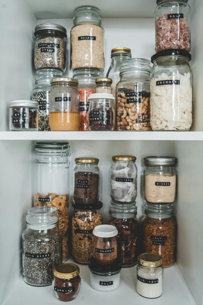 a shelf with jars of food. Decluttering tips