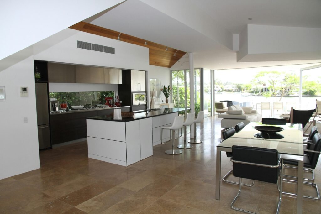 a kitchen and dining area with a large window transformed after a deep clean